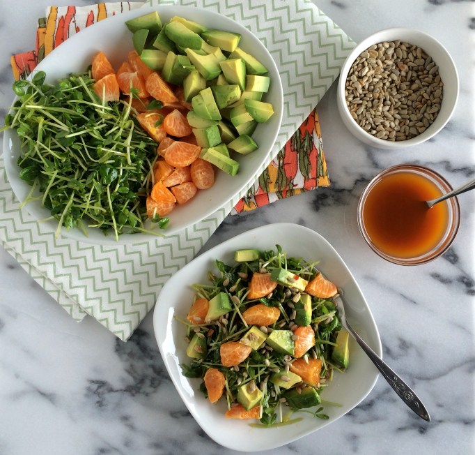 Pea shoots, oranges, and avocados with orange-chili vinaigrette